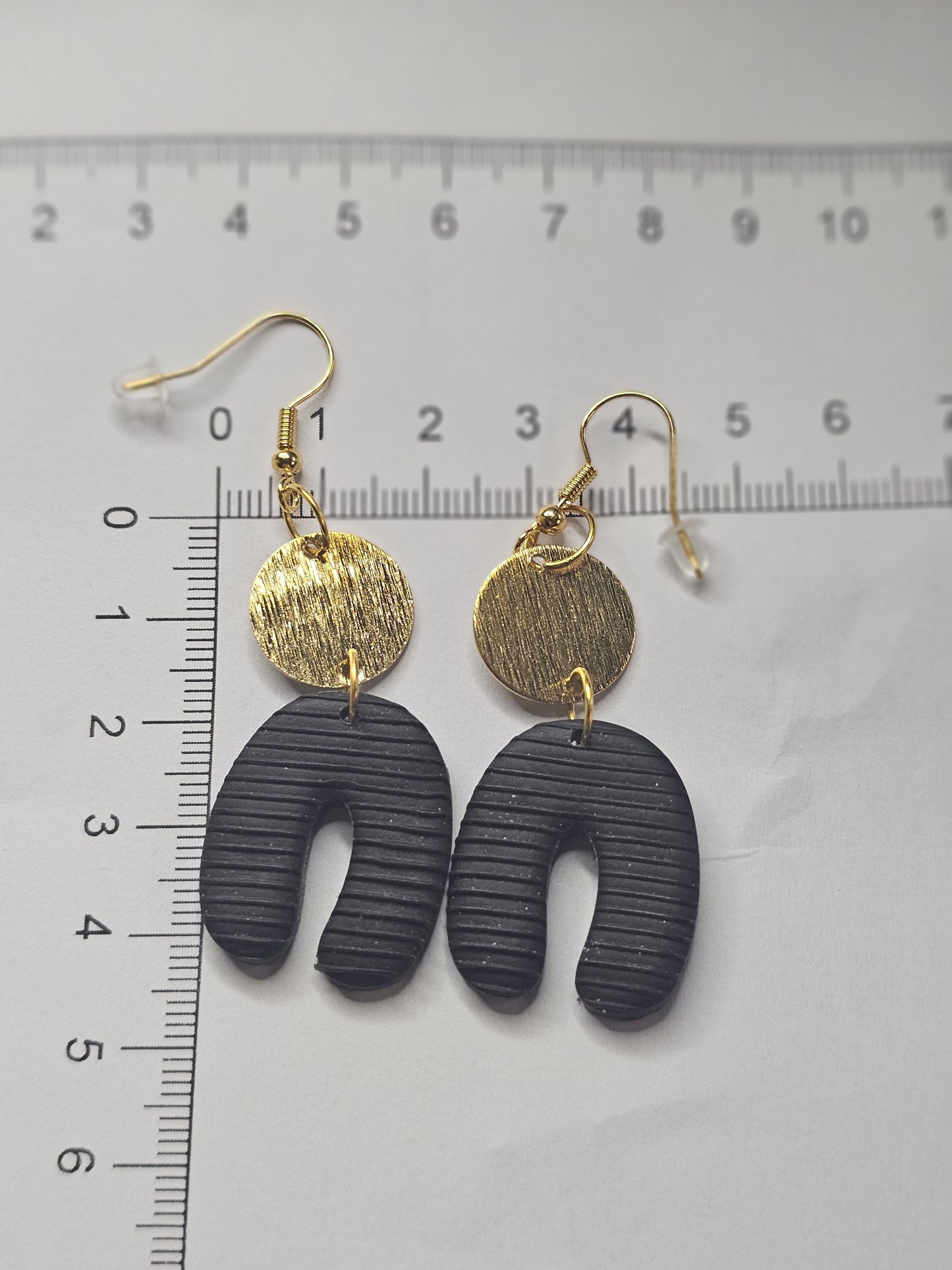 Black Horseshoe Earrings with Golden Accents