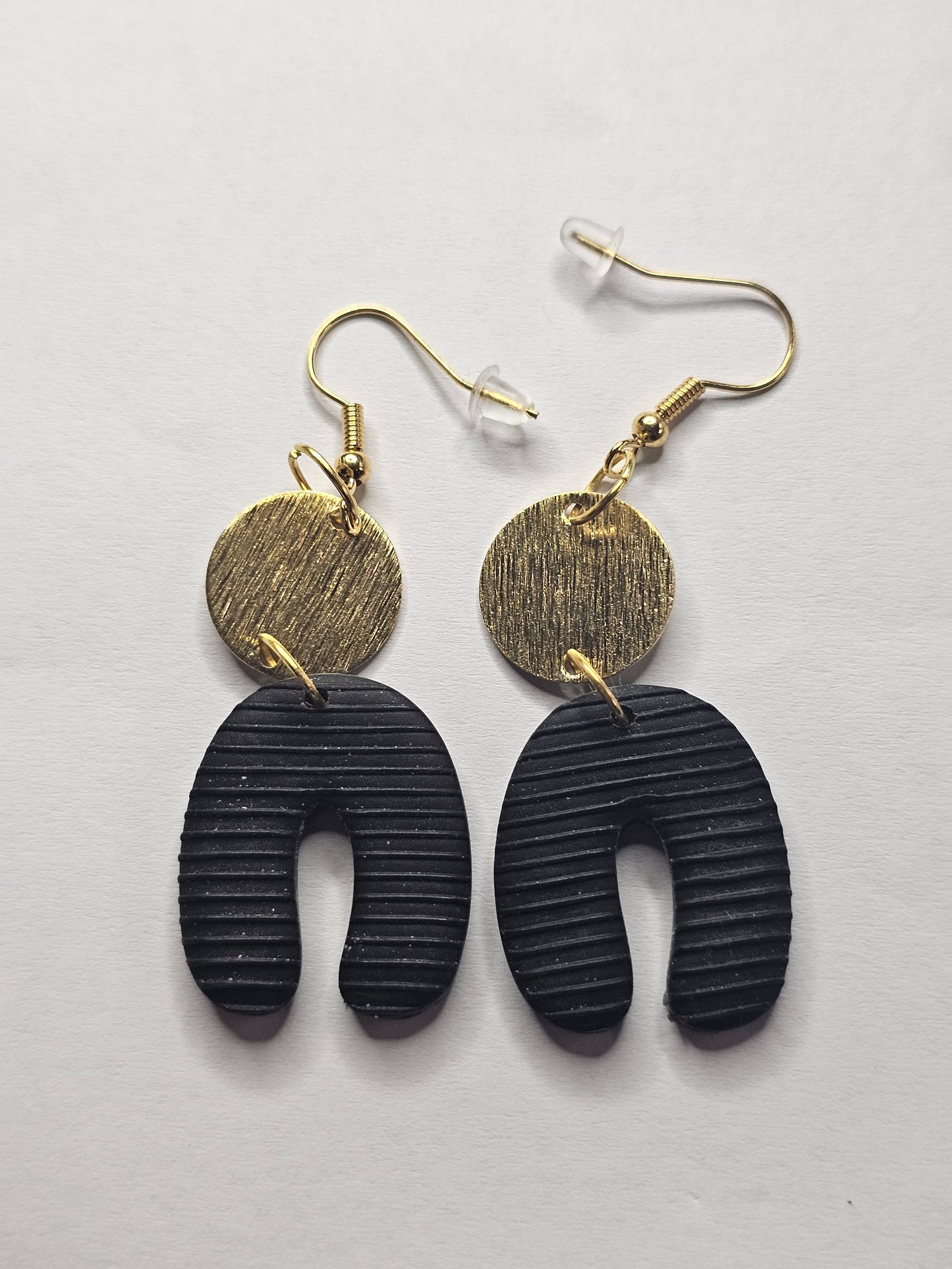 Black Horseshoe Earrings with Golden Accents